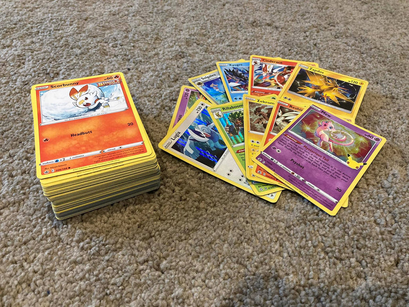 100 Pokemon Cards including 10 Holo Cards